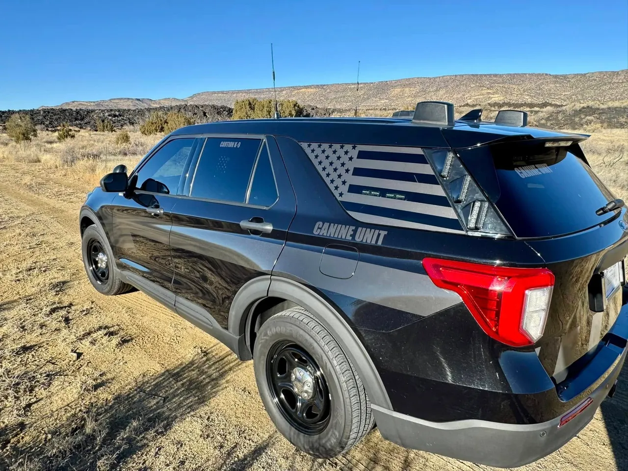 Black Ford Explorer Canine Unit in desert